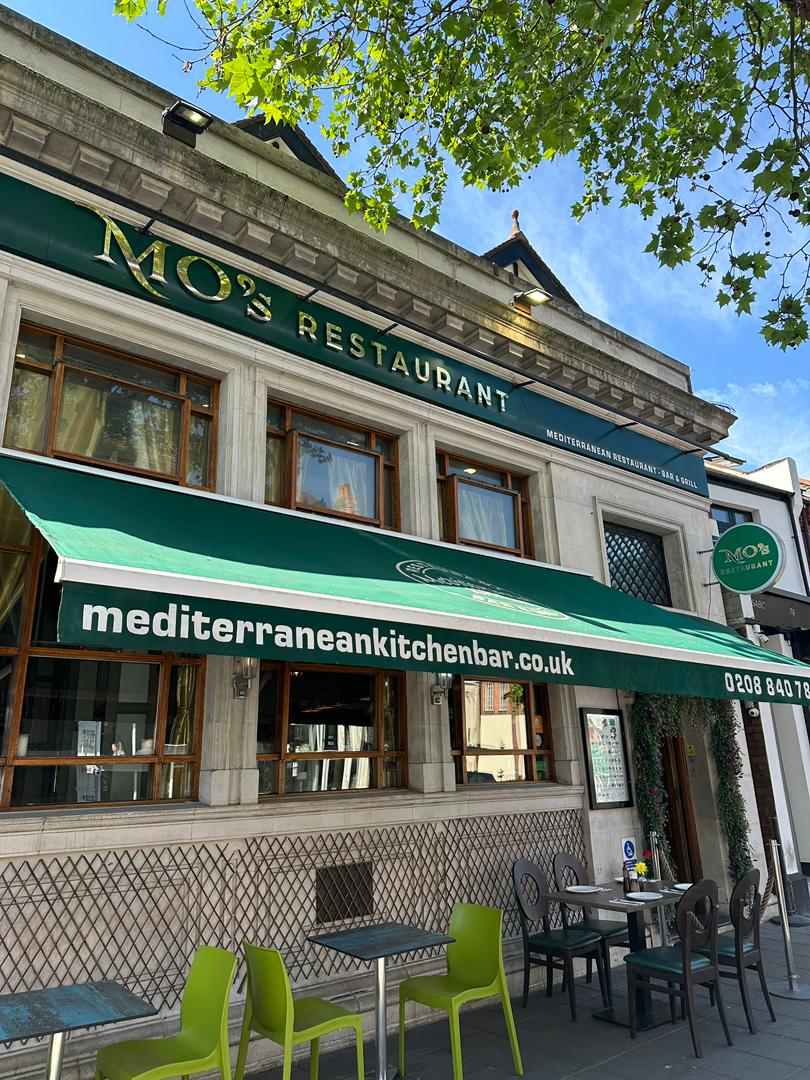 MO's Mediterranean Restaurant storefront with green awning